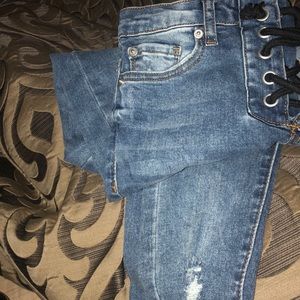 Ashley mason ripped jeans with navy tie at waist